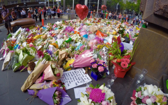 Flowers were laid in Bourke St in memory of the victims of the attack.