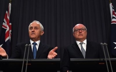PM Malcolm Turnbull and Attorney-General George Brandis discussing the proposed amendment to Section 18C on Tuesday. Photo: AAP Image/Sam Mooy