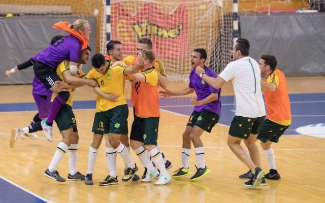 The Australian futsal team celebrating their last-minute victory over Brazil. Photo: Julie Kerbel