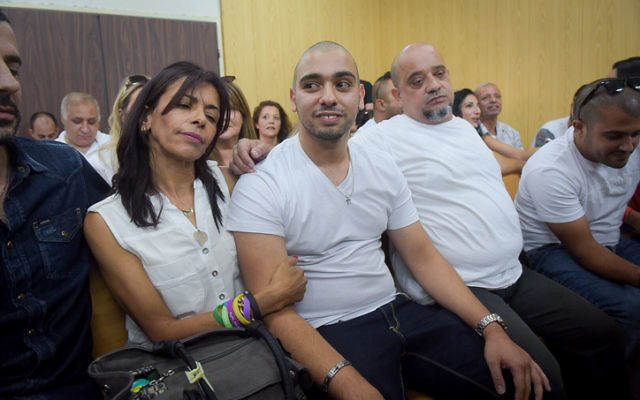 Elor Azaria sitting with his parents in a courtroom at a Tel Aviv military base on Sunday. Photo: Flash 90/Avshalom Sasoni/JTA.
