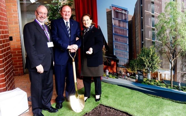 John Gandel turning the first sod at the new wing, alongside his wife Pauline and Dr Michael Walsh. Photo: Peter Haskin