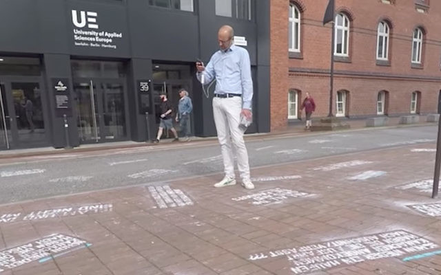 Some of the insulting tweets on the ground at Twitter’s Berlin headquarters. Photo: YouTube screenshot