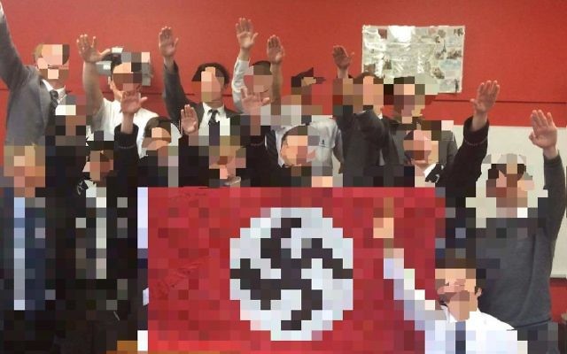 The offending photo of Shore students and their teacher in 2016 posing with a Nazi flag.