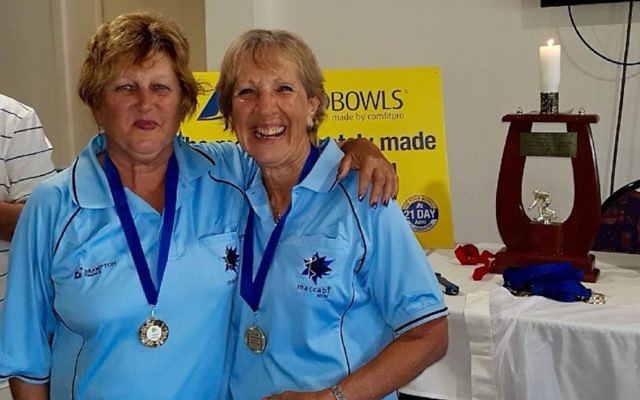 NSW teammates Sandy Desiatnik (left) and Maxine Brem, wearing their gold medals.