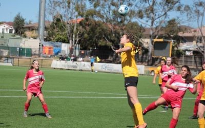 UNSW U15s co-captain Saskia Reisin executes a header in the Football NSW U15s Women's State League grand final win against Parramatta FC on September 17. Photo: Shane Desiatnik