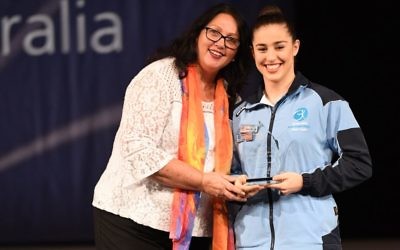 Deborah Greenbaum being presented with the Senior Gymnast of the Year award at the national championships.