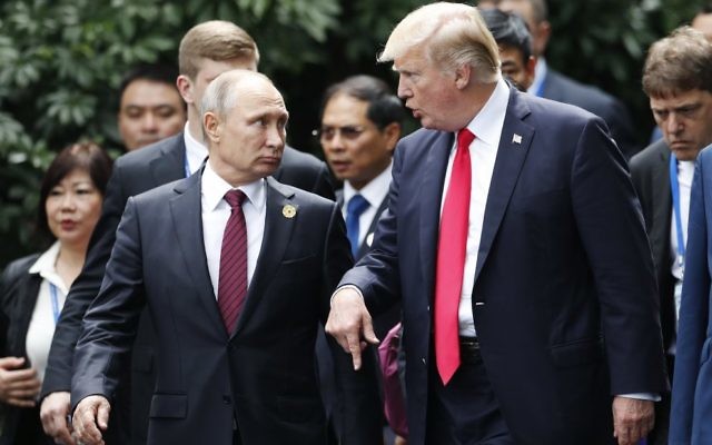 Vladimir Putin (left) and Donald Trump in Vietnam on Saturday. Photo: EPA/Jorge Silva