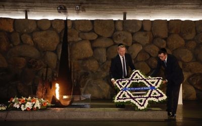 Daniel Andrews (right) and Martin Foley laying a wreath from the people of Victoria at Yad Vashem.