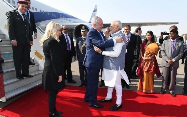 Israel's Prime Minister Benjamin Netanyahu and his wife Sara greeted by Indian Prime Minister Narendra Modi as they arrive in Delhi. Photo: Avi Ohayon, GPO