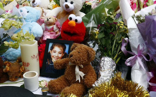 A photo of Thalia Hakin amid floral and soft-toy tributes at the site of last January's Bourke Street tragedy. Photo: Peter Haskin