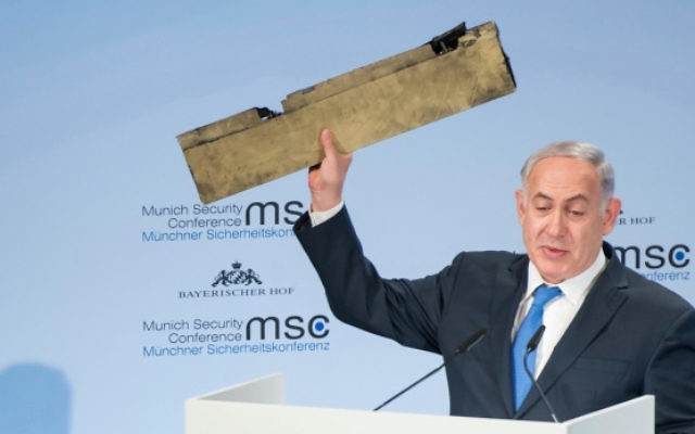 Benjamin Netanyahu holds a part of a downed drone during his speech at the Munich Security Conference. Photo: Lennart Preiss/MSC 2018/dpa via AP