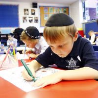 Yeshivah College. xxxx concentration on his drawing. Photo: Peter Haskin