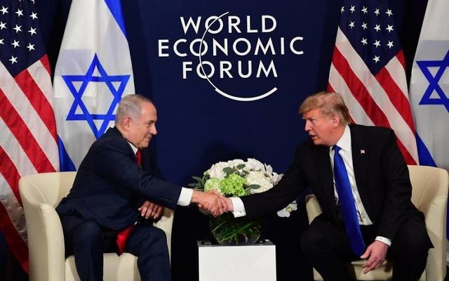 Bejamin Netanyahu with Donald Trump at Davos. Photo: Amos Ben Gershom, GPO