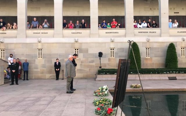 MPs Michael Danby (front) and Mike Kelly lay a wreath for Sergeant Albert Levy during his Last Post ceremony at the Australian War Memorial.