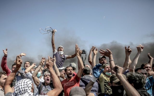 Palestinian protestors near the Gaza border on Monday. Photo: EPA/Mohammed Saber