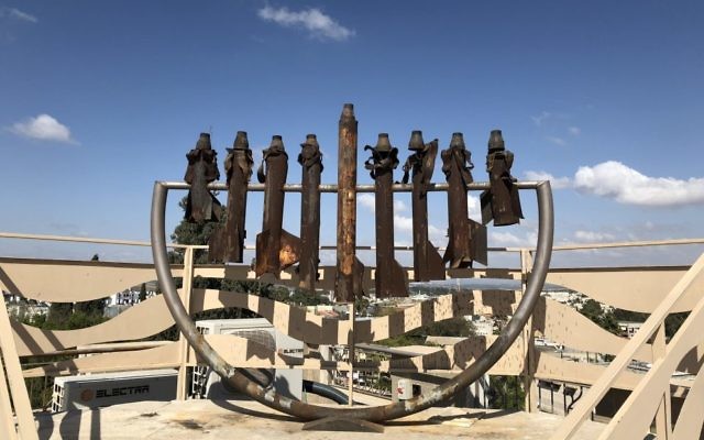 The menorah made of rockets on top of the Hesder Yeshivah.