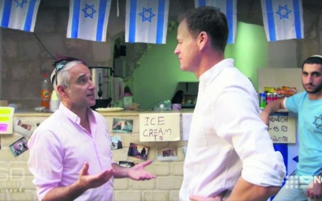 Daniel Luria (left) talking to Tom Steinfort at a shop he has set up in the Muslim Quarter of the Old City.  Photo: Screengrab