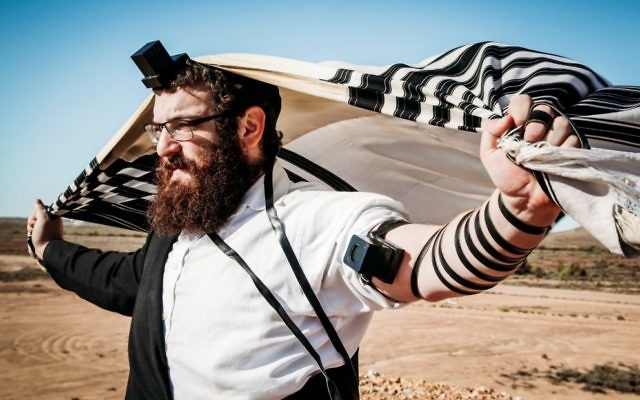 Rabbi Yossi Rodal prays in central Australia during a trip by Chabad of RARA which was filmed for a SBS documentary.