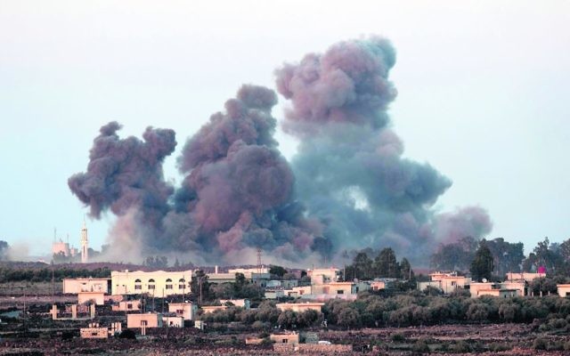The view from Israel following Russian air strikes on the Syrian side of the Golan Heights on Monday. Photo: EPA/Atef Safadi