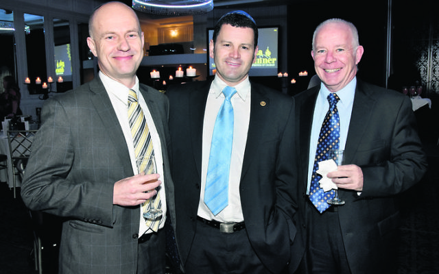 David Citer (centre) with Andy West and Peter Kelly at the Chabad North Shore gala dinner last year. Photo: Noel Kessel