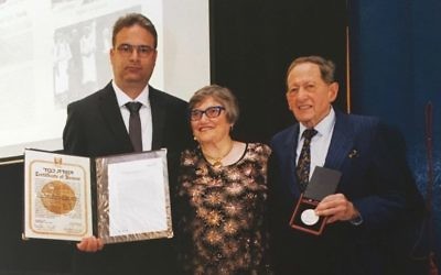 From left: Rejhan Prohic, Aviva Fox and Egon Sonnenschein with the Righteous accolade bestowed by Yad Vashem.