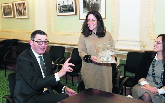 Rebbetzin Dina Kahn presents Premier Daniel Andrews with a gift on behalf of the RCV.  Photo: Peter Haskin