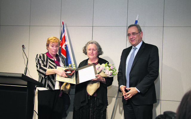Israeli ambassador Mark Sofer (right) presents the medal and certificate to Johanna (Anneke) Winkeler (left) and Petronella Zinsmeester. 
Photo: Gareth Narunsky