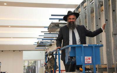 Rabbi Dovid Slavin inspecting the reconstruction of the synagogue at the Harry Triguboff Centre at Flood Street, which will reopen in time for Rosh Hashanah. Photo: Shane Desiatnik