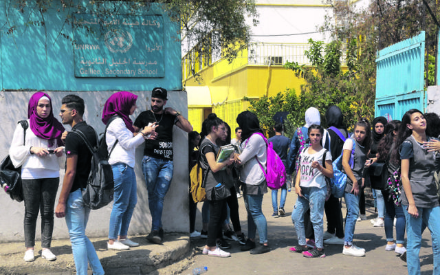 Palestinian students outside a UNRWA school in Beirut. Photo: EPA/Nabil Mounzer