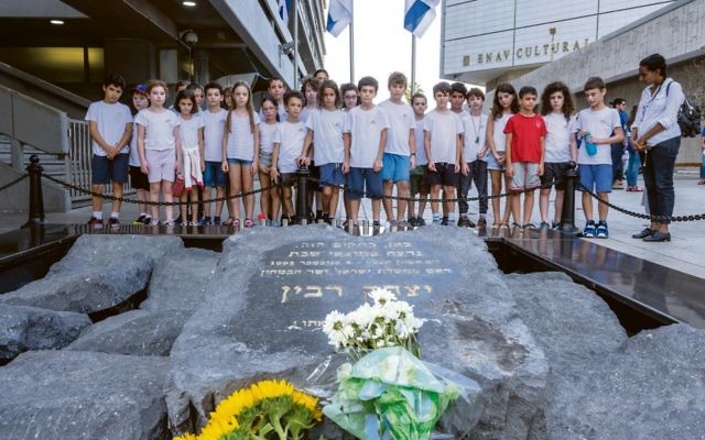 Israeli school children visit the Yitzhak Rabin memorial in Rabin Square in Tel Aviv to mark the 23rd anniversary of his assassination. Photo: EPA/Jim Hollander