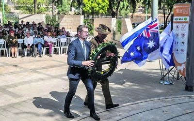 Australian ambassador to Israel Chris Cannan laying a wreath at the Beersheba commemoration.