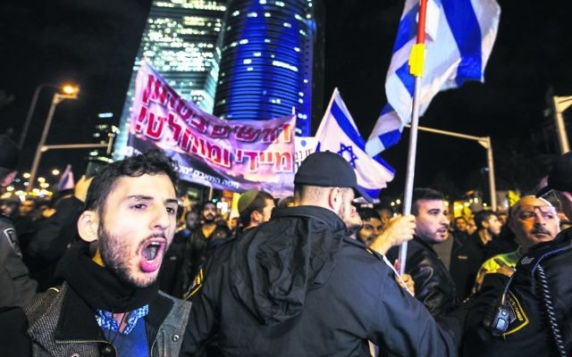 Protesters in Tel Aviv demonstrating against the government. Photo: EPA/Jim Hollander