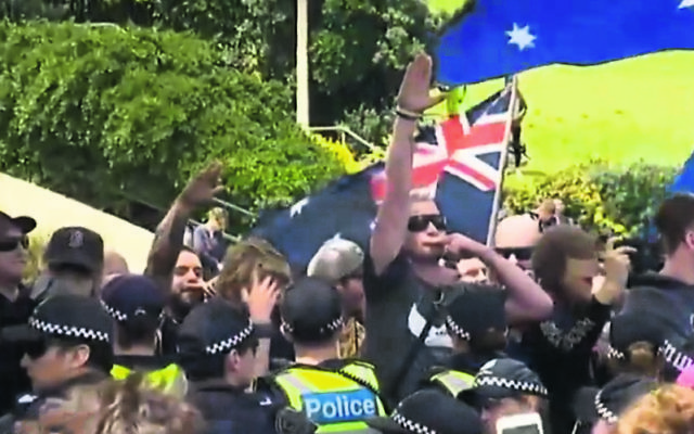 People at the rally performed Nazi salutes. Photo: Screengrab, ABC News