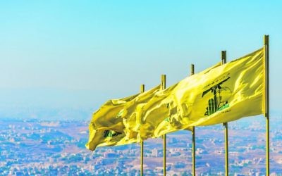 Hezbollah flags in southern Lebanon. The UK will be banning Hezbollah in its entirety, not just its military wing. Photo: John Grummet/Dreamstime.com