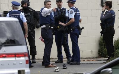 Police stand outside a mosque in central Christchurch, New Zealand, Friday, March 15, 2019. Multiple people were killed in mass shootings at two mosques full of people attending Friday prayers, as New Zealand police warned people to stay indoors as they tried to determine if more than one gunman was involved. (AP Photo/Mark Baker)