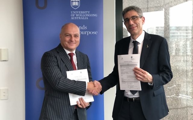 Professor Alex Frino (left) and Professor Oron Shagrir after signing the
agreement.