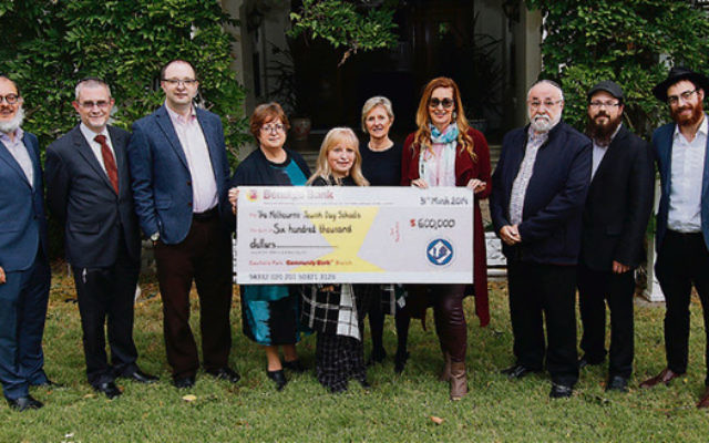 The Jewish Children’s Aid Society presents a cheque for $600,000 to the
principals of Melbourne’s Jewish schools. Photo: Peter Haskin