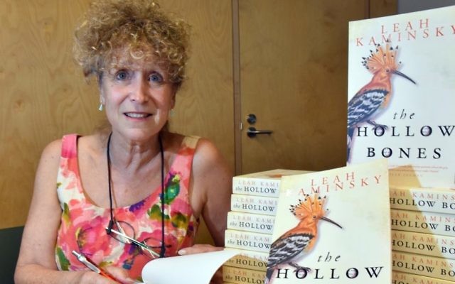 Author Leah Kaminsky with copies of her latest novel,
The Hollow Bones. Photos: Noel Kessel