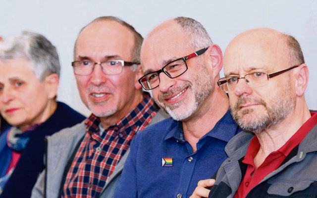 A beaming Michael Barnett (second from right) of Aleph Melbourne with
husband Gregory Storer (right) after the historic apology motion was
accepted at Monday night’s JCCV plenum. Photo: Peter Haskin