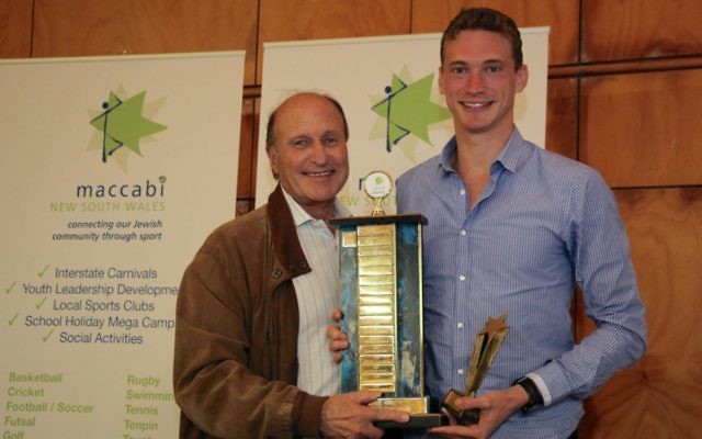 Steven Solomon (right) accepting the Maccabi NSW Sportsman of the Year
award and Lou Rose Trophy from Maccabi World Union vice-president Tom
Goldman on March 31. Photo: Shane Desiatnik