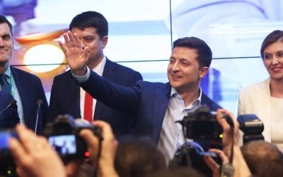Volodymyr Zelensky, second from right, waves to supporters at his campaign headquarters in Kiev, Ukraine, April 21, 2019. He won the country’s presidential election with over 70 percent of the vote. Photo: Xinhua/Sergey/Getty Images