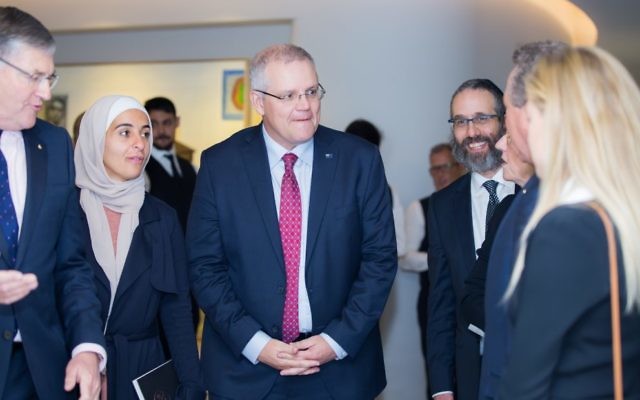 Prime Minister Scott Morrison (centre) with Amna Karra-Hassan (left) and
Rabbi Zalman Kastel (right) at a Together for Humanity function last year.