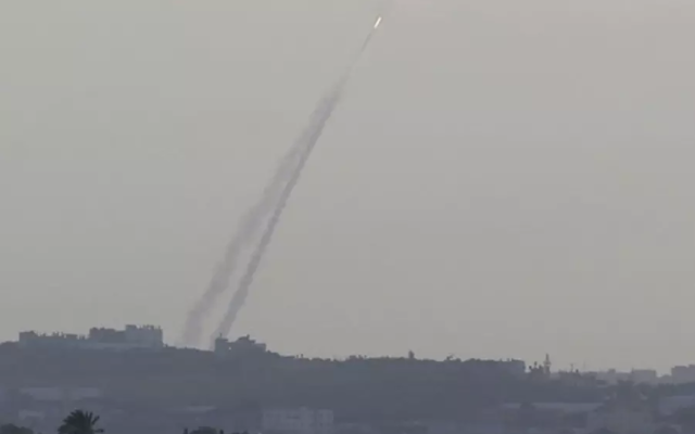 Smoke trails are seen as a rocket is launched from the northern Gaza Strip towards Israel. Photo: Reuters