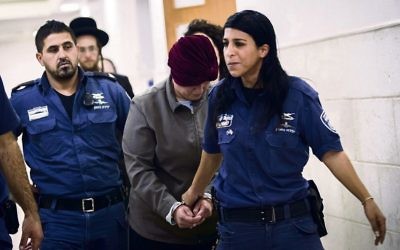 Malka Leifer being led into the Jerusalem District court last February.
Photo: EPA