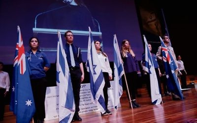 Zionist youth movement and Australasian Union of Jewish Students flag
bearers at Tuesday’s Yom Hazikaron ceremony in Melbourne. Photo: Peter Haskin