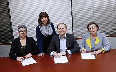 NCJWA (Vic) president Miriam Bass (second from left) oversees the signing of the NCJWA Gender Equality Pledge by
(from left) Jennifer Huppert (JCCV), Jeremy Leibler (ZFA) and Sharene Hambur (Zionism Victoria). Photo: Peter Haskin