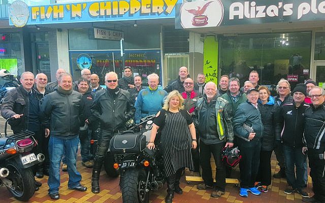 Bikers from Yids on Wheels visit Aliza’s Place cafe to show solidarity with
proprietor Aliza Shuvaly (front).