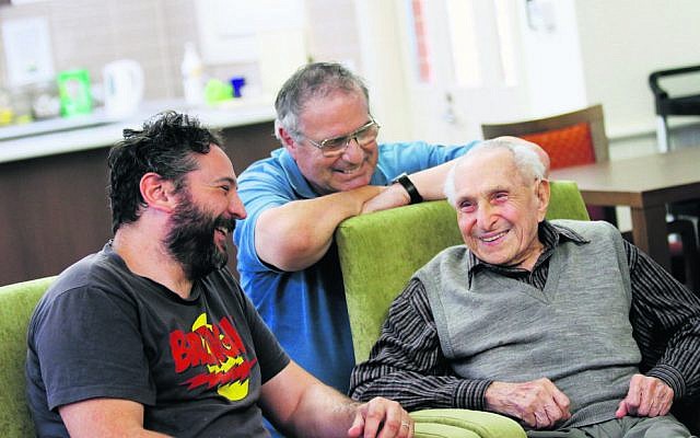 Leo Buchler (right) after his 108th birthday last year, with grandson David (left) and son Paul. Photo: Peter Haskin