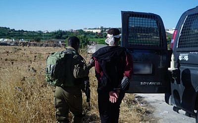 Israeli soldiers arrest two Palestinian men suspected in the muirder of yeshiva student Dvir Sorek on Aug. 10, 2019 from their homes in the Palestinian village Beit Khalil, north of Hebron in the West Bank. Photo: IDF