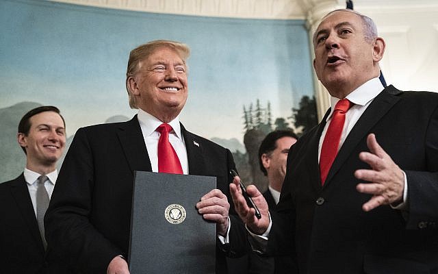 President Donald Trump and Israeli Prime Minister Benjamin Netanyahu, right, talk after signing a presidential proclamation on Golan Heights in the Diplomatic Reception Room at the White House, March 25, 2019. (Jabin Botsford/The Washington Post via Getty Images)